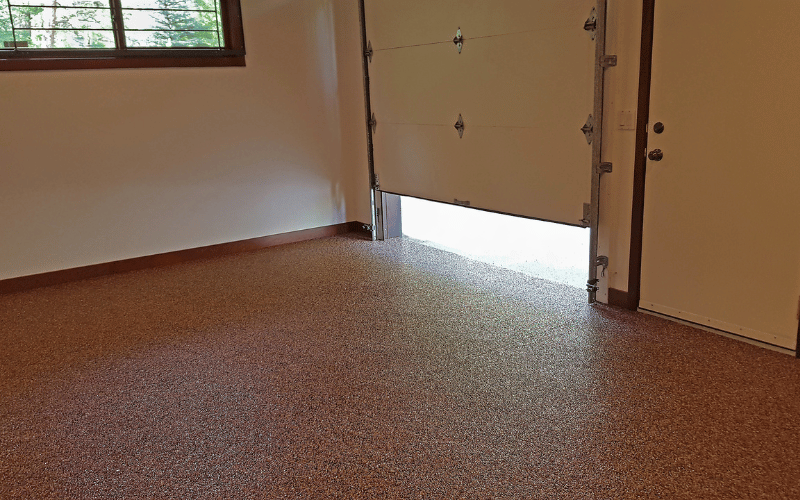 Brown epoxy floor in one car garage