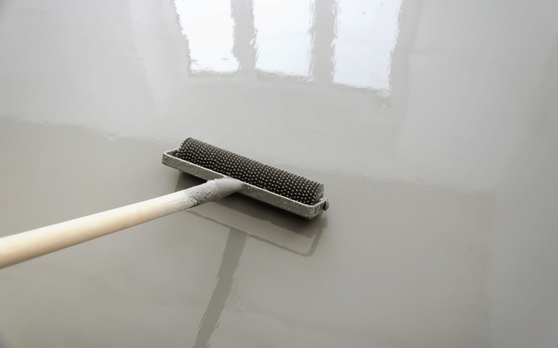 Roll on gray epoxy floor installation